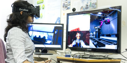 Woman at a computer with VR headset
